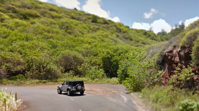 Jeep driving the Kahekili Hwy on the Island of Maui